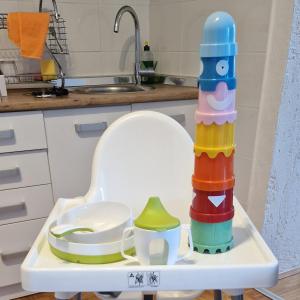a stack of stacking toys on a tray in a kitchen at Apartments Barac in Poreč