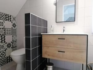 a bathroom with a sink and a toilet at Au fil de la lys in Merville