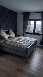 Ένα ή περισσότερα κρεβάτια σε δωμάτιο στο Ferienwohnung Sonne