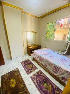 Un pat sau paturi într-o cameră la Salam Appartment