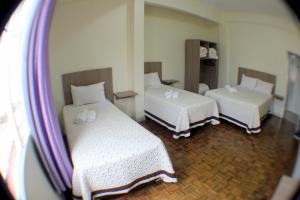 Krevet ili kreveti u jedinici u okviru objekta Hotel Condá