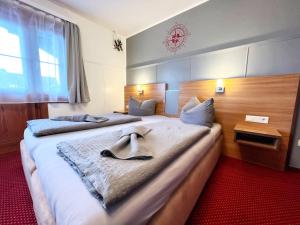 Postel nebo postele na pokoji v ubytování BnB Fliegerhaeusle Hagnau 24h Self Check In