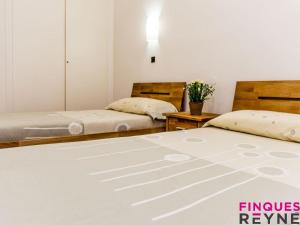 Postel nebo postele na pokoji v ubytování Sant pere 11
