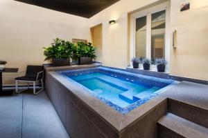 a swimming pool in the middle of a house at Catalonia Plaza Mayor in Madrid