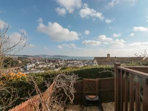 a view of the city from the balcony of a house at Bay View in Paignton
