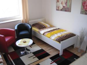 Tempat tidur dalam kamar di Bahnhofstr Apartment