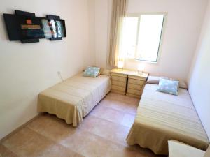 Posteľ alebo postele v izbe v ubytovaní Duplex Vall d'aro F32076