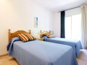 Posteľ alebo postele v izbe v ubytovaní Duplex Vall d'aro F32076