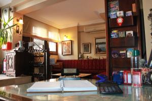 a bar in a restaurant with a counter with books at Hotel SultanHill in Istanbul