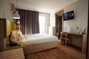 Postel nebo postele na pokoji v ubytování Elements Rooms & Apartments