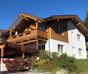 a large house with a balcony on top of it at Haus Ottilia - Top 5 in Neukirchen am Großvenediger