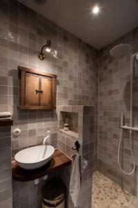 a bathroom with a sink and a shower at The Meetinn in Waverveen