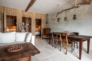 a living room with a table and a couch at The Meetinn in Waverveen +44 photos