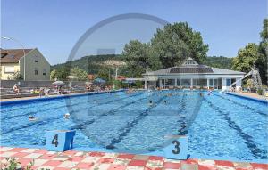 a large swimming pool with many people in it at Naturama Beilngries Haus 4 in Beilngries