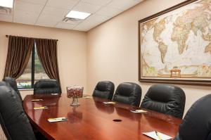 a conference room with a large world map on the wall at Super 8 by Wyndham Pennsville/Wilmington in Pennsville
