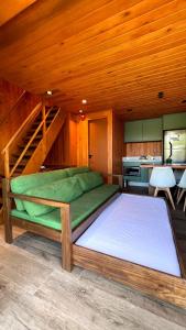 a bedroom with two beds in a wooden room at Grandi Pousada Sports - Sambaqui - Chalé Jurerê, Chalé da Mole e 3 Cabanas in Florianópolis