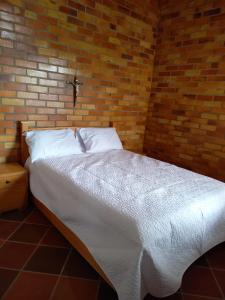 Postel nebo postele na pokoji v ubytování Cabañas GARUTO