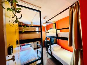 a room with two bunk beds and a mirror at Hostel Le Banc in Istanbul