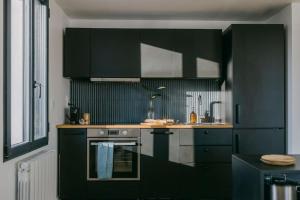 Kuchyňa alebo kuchynka v ubytovaní Le Duplex de Maison Passage + 22 fotografií
