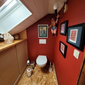 a small bathroom with a toilet in an attic at L'Atelier Bed and Breakfast in Andrimont +22 photos