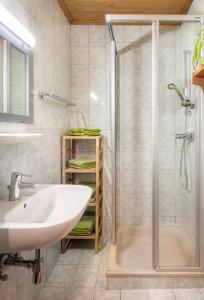 a bathroom with a sink and a shower at Hallmoosgut in Sankt Johann im Pongau