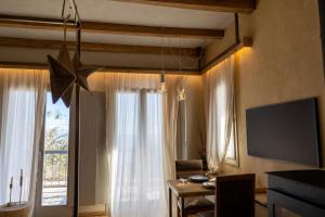 a living room with a star hanging from the ceiling at Mazaraki Guesthouse in Mystras