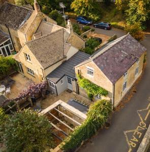 an overhead view of a large house with a street at Cotswolds Corner Cottage in Moreton in Marsh