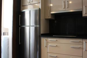 Kuchyňa alebo kuchynka v ubytovaní Bahía Boutique Apartments