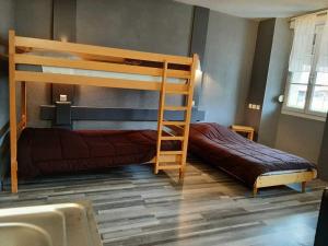 Postel nebo postele na pokoji v ubytování Hôtel de La Vallée