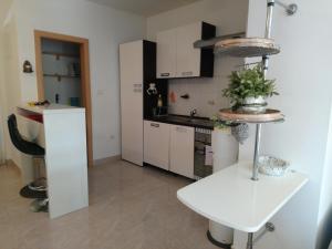 Virtuvė arba virtuvėlė apgyvendinimo įstaigoje Eco friendly apartment