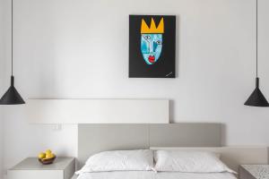 Postel nebo postele na pokoji v ubytování Palazzo Novecento
