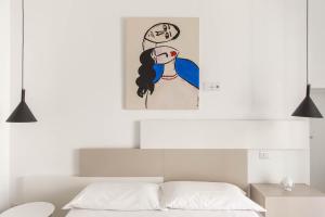 Postel nebo postele na pokoji v ubytování Palazzo Novecento
