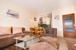 a living room with a couch and a table at Apartmenthaus Frauenpreis FeWo 205 in Cuxhaven