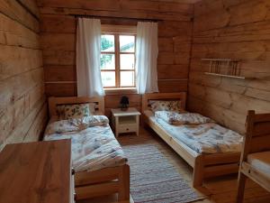 Кровать или кровати в номере Dom z bali. Chata Michal.