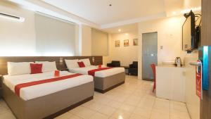 Postel nebo postele na pokoji v ubytování RedDoorz at V Plaza Hotel Manila