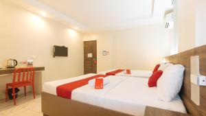 Postel nebo postele na pokoji v ubytování RedDoorz at V Plaza Hotel Manila