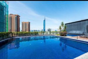 a large swimming pool on top of a building at Bukit Bintang Fairlane Residences Twin Towers View in Kuala Lumpur