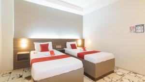 Postel nebo postele na pokoji v ubytování RedDoorz at V Plaza Hotel Manila