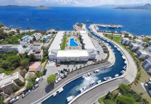 an aerial view of a marina with cars parked at Lugga Boutique Hotel & Beach in Ortakent