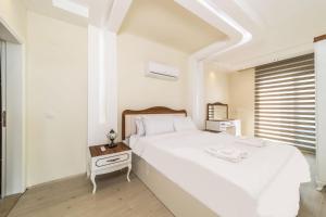 Krevet ili kreveti u jedinici u objektu Spacious Apartment with Sea View in Alanya
