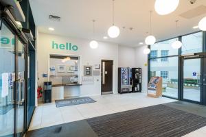 a store lobby with a hello sign on the wall at University of Bath City Accommodation in Bath