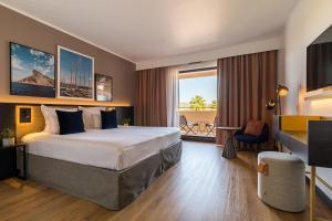 Llit o llits en una habitació de Hôtel Villa M Marseille
