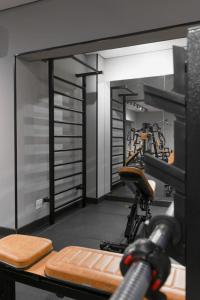 a gym with a exercise bike in a room at Araçatuba Plaza Hotel in Araçatuba
