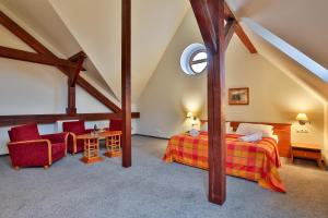 Łóżko lub łóżka w pokoju w obiekcie LH Hotel Dvořák Tábor Congress & Wellness