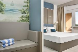 Posteľ alebo postele v izbe v ubytovaní Golf Hotel Punta Ala