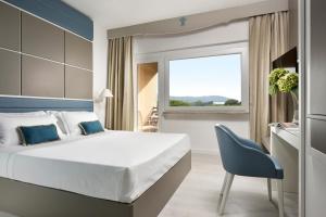 Posteľ alebo postele v izbe v ubytovaní Golf Hotel Punta Ala