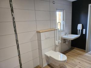 Kúpeľňa v ubytovaní Chambres Jura Sud