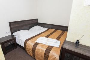Postel nebo postele na pokoji v ubytování Готель Скіфія
