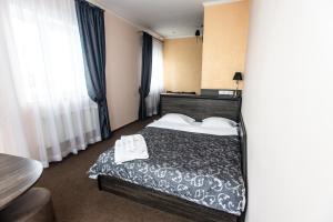 Postel nebo postele na pokoji v ubytování Готель Скіфія
