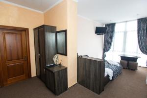 Postel nebo postele na pokoji v ubytování Готель Скіфія